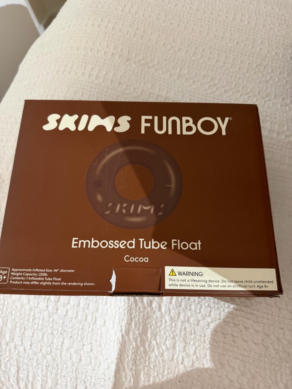 Funboy x skims embossed tube pool float